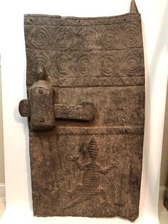 an ancient door with a lock on it in a museum display case at the british museum