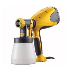 a yellow and black blow dryer sitting on top of a white cup