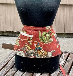 an apron is sitting on top of a wooden table