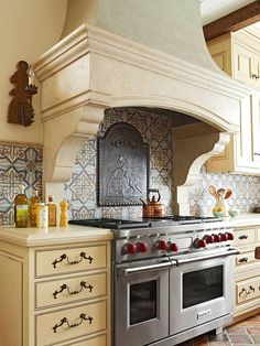 a stove top oven sitting inside of a kitchen next to a wall mounted oven hood