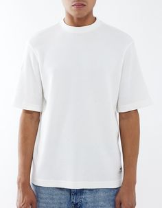 Bdg Urban Outfitters True Waffle Tee. Allover Waffle Knit Construction. Crew Neck. Short Sleeve. 100% Cotton. Machine Wash. Imported. White Waffle Knit Tops For Summer, Ribbed Short Sleeve Top For Streetwear, Modern Relaxed Fit Ribbed Tops, Oversized White Ribbed Top, Modern Ribbed Relaxed Fit Tops, White Waffle Knit Top With Relaxed Fit, Summer Waffle Knit Crew Neck Top, Summer Waffle Knit Top With Crew Neck, Relaxed Fit Waffle Knit Crew Neck Top