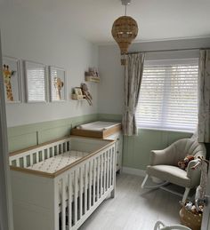 a baby's room with a crib and rocking chair