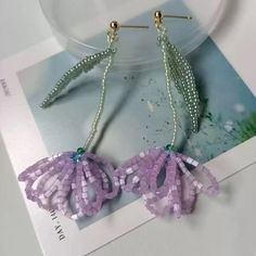 the earrings are made out of plastic beads