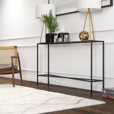 Made of durable steel, this console table makes a modern, industrial-inspired addition to any living area. The clean lines of the tabletop and frame are offset by the geometric crossbar, creating visual interest without weighing down the look. With a neutral metallic finish and streamlined design, it's easy to incorporate into a variety of styles and spaces. Hailey Home Industrial Blackened Bronze Console Table | AT0823 Havenly Dining Room, Steel Console Table, Metal Console Table, Metal Console, Sofa Tables, Console Tables, Nebraska Furniture Mart, Online Furniture Stores, Sofa Table