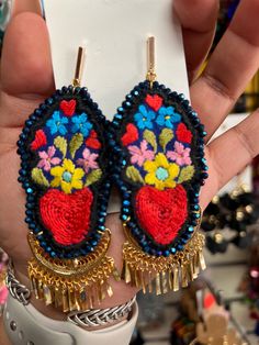 Beautiful and unique handmade earrings hand embroidered by Mexican artisans. We complement with pieces of handmade filigree 18k gold plated. Filigree is a handcrafted jewel made using the olfebre technique with silver, copper, and tumbaga threads and then plated in 18k gold. Bohemian Beaded Embroidered Earrings For Festivals, Multicolor Embroidered Bohemian Earrings, Bohemian Embroidered Earrings For Festive Occasions, Bohemian Embroidered Festive Earrings, Bohemian Floral Embroidery Earrings For Gifts, Bohemian Floral Embroidered Earrings As Gift, Traditional Embroidered Drop Earrings, Bohemian Embroidered Drop Earrings, Mexican Earrings