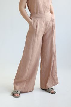 "Wide linen long pants. Cut from medium weight linen, they have a comfortable elasticated waist at the back and wide-leg shape. You will always stand out and feel super stylish wearing them. We recommend them in any solid linen color or sophisticated Exclusive colors. Wear them with any shoes, from your highest heels to sneakers. ABOUT US LINEN ID was born from desire to embrace things that actually matter. We aim to create sustainable garments that offer uncompromised design, are versatile and Elegant Wide Leg Flax Pants, Relaxed Fit Linen Wide Leg Pants, Bohemian Wide Leg Linen Pants With Pockets, Bohemian Linen Wide Leg Pants With Pockets, Bohemian Wide-leg Linen Pants, Wide Leg Linen Harem Pants With Elastic Waistband, Linen Wide Leg Harem Pants With Elastic Waistband, Linen Full-length Harem Pants For Spring, Full Length Linen Harem Pants For Spring