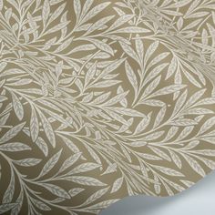 an image of a wallpaper with leaves on it's back side and beige background