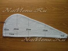 the measurements for an oven mitt on top of a wooden table