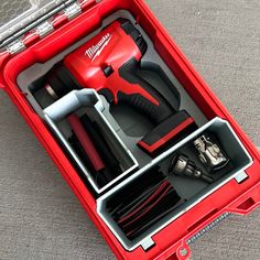 a red tool box with tools in it