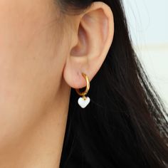 Expertly crafted to a small stud silhouette. Very elegant and suitable for everyday wearing. If your skin is sensitive, this is the earrings for you. They are non tarnish, waterproof and made by surgical implant grade titanium. Materials: Titanium Location: Colorado, United States Closure: Clip on Post: 18 gauge (1 mm) Style: Minimalist * Crafted on surgical grade titanium.  * Nickel, free and hypoallergenic * Sold as a pair O T H E R ∙ I N F O R M A T I O N * All items are nicely packaged ready Petite Silhouette, Heart Huggies, Huggies Hoop Earrings, Titanium White, Style Minimalist, White Heart, Earrings Vintage, Make Design, Elegant Jewelry