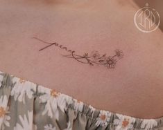 a woman's chest with the word love written in cursive writing on it