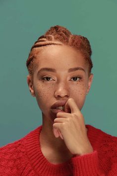 an image of a woman with freckles on her face looking at the camera