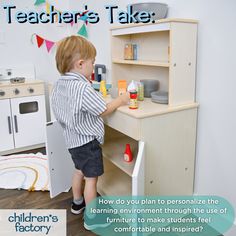 a young boy playing with toys in a play kitchen and learning to learn how to use it