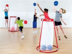 children playing with balls in an indoor gym