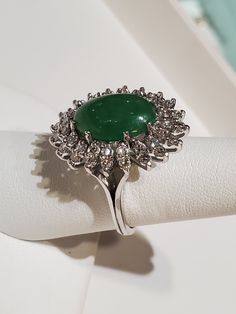 "Platinum Natural Green oval Cabochon Jade And Diamond Ring . The ring measures approx 12.79 grams. The ring size is approx. 6 1/2 can size up or down. The diamond measures .60ctw. The jade itself measures approx.10mm x 14mm oval shape. The ring itself measures approx.24mm x21mm oval shape. The ring marked plat. Inside means platinum. If you have any question send me a message... When listing and describing our items we make a conscious effort to over describe all imperfections and blemishes. Th Oval Dome Ring Hallmarked For Anniversary, Oval Dome Ring For Anniversary In Fine Jewelry Style, Hallmarked Oval Dome Ring For Anniversary, Anniversary Dome Ring Hallmarked, Oval Diamond Cabochons For Formal Occasions, Formal Oval Cabochon Emerald Ring, Classic Oval Cabochons For Anniversary, Green Oval Dome Ring For Formal Occasions, Fine Jewelry Oval Dome Ring For Anniversary