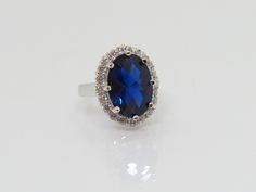 Vintage Sterling Silver Oval Blue Sapphire & White Topaz Ring...Marked 925...Total of weights 5.6grams... Size 6...Measure of Face 18.3MM...It's in very good condition. A Topaz Ring, White Topaz, Solitaire Ring, Vintage Sterling Silver, Blue Sapphire, Sapphire Ring, Topaz, Sapphire, Ring Size