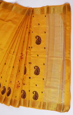 This Saree is Ready to Wear (With Fall and Pico Done). A designer saree in Yellow Color. It has intricate design all over the saree. This saree is a suitable amalgamation of style and grace that is required from an ethnic wear. The saree is ideal for any formal gathering. The saree comes with an unstitched blouse of corresponding color and design as shown in the picture. Silk Designer Yellow Color Saree Fabric Type: SilkPrimary Colour: YellowSecondary Colour(s): GoldenSaree Length: 6.0 meters in Traditional Slub Silk Pre-draped Saree For Celebration, Bollywood Style Tussar Silk Pre-draped Saree With Motifs, Diwali Motifs Pre-draped Raw Silk Saree, Festive Yellow Tussar Silk Pre-draped Saree, Festive Unstitched Slub Silk Pre-draped Saree, Festive Silk Pre-draped Saree With Motifs, Tussar Silk Churidar With Zari Work, Chanderi Pre-draped Saree With Motifs For Puja, Yellow Art Silk Churidar With Cutdana