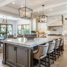 This picturesque food preparation zone includes a central island and integrated storage Kitchen With Square Island, Large Square Kitchen Island, Kitchen Lighting Fixtures Flush Mount, Big Kitchen Island, Images Of Kitchen Islands, Kitchen With Big Island