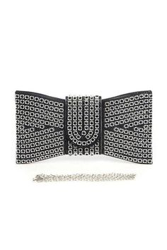 Elevate your style with our Rhinestone Bowtie Iconic Clutch Bag. Adorned with sparkling rhinestones, this bag adds a touch of glamour to any outfit. The iconic bowtie design adds a touch of sophistication, making it perfect for any occasion. Make a statement with this one-of-a-kind clutch bag. Length - 10.75" Width - 1.35" Height - 5.8"Includes Shoulder ChainSnap On Closure Lead & Nickel Compliant Chic Evening Bag With Bling For Night Out, Chic Rhinestone Event Bag, Chic Rhinestone Event Bags, Trendy Rhinestone Evening Bag For Night Out, Chic Rhinestone Evening Bag For Night Out, Chic Evening Bag With Rhinestones For Night Out, Chic Bling Clutch Bag, Elegant Evening Bags With Rhinestone Rivets, Chic Rhinestone Bags For Fashion Accessory