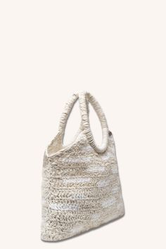 This version of our VARLET Bag is a macrame offering, woven by hand to incorporate raw-edge strips of cotton poplin. It is lighter than previous versions, and has a hard-wearing, ruched cotton poplin handle that can be worn over the shoulder or hand-carried. A spacious bag for everyday. Also offered in Black. Beige Crochet Bag With Double Rolled Handles, Beige Crochet Double Handle Bag With Rolled Handles, White Cotton Bucket Bag, Beige Woven Cotton Straw Bag, Rectangular Cotton Shoulder Bag With Rolled Handles, Neutral Crochet Bag With Braided Handles For Daily Use, Cream Bags With Braided Round Handles, White Eco-friendly Crochet Bag With Leather Handles, Cotton Straw Tote Bag With Braided Handles