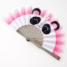 a pink and white fan with panda faces on it