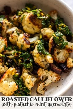 roasted cauliflower with pistachio, mint and garlic in a white bowl