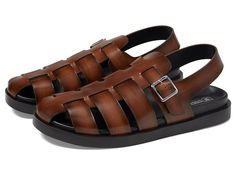 Stacy Adams Montego Slingback Buckle Sandal - Men's Sandals : Cognac : Let your feet feel the ideal comfort while donning the Stacy Adams Montego Slingback Buckle Sandal. These fisherman sandals feature fully cushioned foam footbed for superior padded cushy comfort and shock absorption, EVA midsole for added cushioning and rebound responsiveness, and slingback adjustable buckle closure. Leather upper. Brand detailing on the footned. Round toe design. Synthetic and rubber outsole. Imported. Measurements: Weight: 1 oz Product measurements were taken using size 9, width M. Please note that measurements may vary by size. Fisherman Sandals, Men's Sandals, Buckle Sandals, Toe Designs, Mens Sandals, Product Reviews, Cognac, Shoes Sandals, Leather Upper