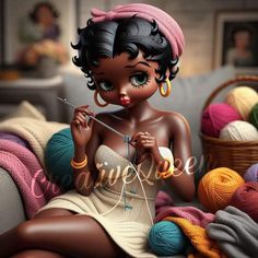 a doll sitting on top of a couch next to balls of yarn and knitting needles