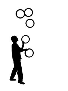 a man holding two circles in his hand while standing next to each other on a white background