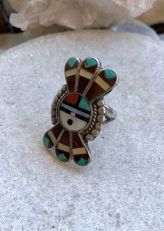 Beautiful Zuni Sun Native American Turquoise Coral Mother Of Pearl Stone Inlay Vintage Ring signed by artist ring size 7 3/4 Face ring measures over 1 1/2 tall by slightly under 1 in wide Green Southwestern Style Jewelry With Inlay, Southwestern Style Green Inlay Jewelry, Multicolor Collectible Ring Jewelry, Adjustable Inlay Jewelry Ring, Artisan Turquoise Ring With Inlay, Adjustable Multicolor Artisan Turquoise Ring, Artisan Adjustable Turquoise Ring With Inlay, Southwestern Style Rings With Inlay, Vintage Green Turquoise Ring With Inlay