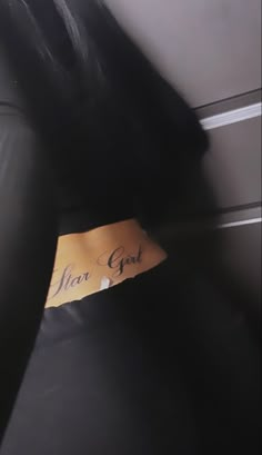 a leather chair with a note on it that says hear god in cursive writing