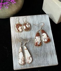 "Main Stone:  Wild Horse  Metal:  Sterling Silver Style:  Earrings Set A Stone size:  1/2\" x 1\" Length with drop:  1.75\" Set B Stone Size:  5/8\" x 1 1/8\" Length with Drop:  1  7/8\" Set C Stone Size:  5/8\" x 1\" Length with drop:  1.75\" Key Features: Bold and beautiful Wild Horse stone This brilliant Wild Horse earrings will complement everything you wear.  They have brilliant white with a reddish brown matrix that is gorgeous!  Wild Horse is a beautiful stone that comes from around the G Artisan Teardrop Jewelry For Anniversary, Southwestern Silver Earrings With Natural Stones, Southwestern White Drop Earrings, Brown Sterling Silver Teardrop Jewelry, Southwestern Nickel-free Jewelry As Gift, Nickel-free Southwestern Style Jewelry As Gift, Brown Teardrop Sterling Silver Jewelry, Nickel-free Southwestern Style Jewelry For Gift, Nickel Free Southwestern Jewelry For Gift