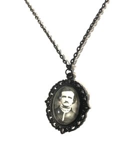 Edgar Allen Poe, a classic, gothic literary genius enthralled us with his dark poetry and short stories of horror and woe. A handmade photo pendant necklace measuring 50cm in length. The pendant inner photo image measures 25 x 18 mm and is set behind glass in a black filigree oval pendant frame. The necklace is set with a lobster clasp closure. Thank you for looking  pleas follow my Instagram @helloween_13 for upcoming products and updates Black Engraved Necklace For Halloween, Black Round Pendant Necklace Collectible, Black Pendant Necklace For Memorial, Black Round Pendant Necklace For Memorial, Black Collectible Necklace For Halloween, Black Cameo Medallion Necklace, Black Cameo Necklace Gift, Black Cameo Necklace As A Gift, Black Cameo Necklace For Gift