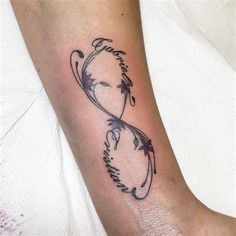 a woman's foot with a tattoo on it