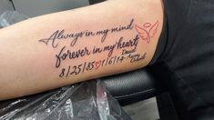 a person with a tattoo on their arm that says, always in my mind forever in my heart