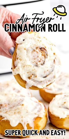 an image of cinnamon roll being dunked with icing