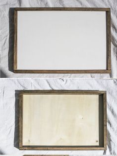 two wooden frames sitting on top of a white sheet