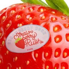 a close up view of a strawberry with the label on it's back side