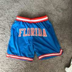 Basketball Shorts Custom “Florida” Text On Front Collegiate Blue Sports Bottoms, Sporty Blue Pants With Letter Print, Blue Pants With Letter Print For Summer, Summer Blue Pants With Letter Print, Casual Blue Shorts With Letter Print, Blue Sports Shorts With Elastic Waistband, Blue Short Bottoms With Letter Print, Blue Bottoms With Letter Print, Short Length, Blue Letter Print Short Bottoms