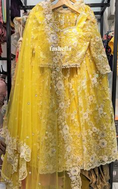 Beautiful Sunshine Yellow Lehenga Set with threadwork and white sequin embroidery!  Blouse: Thread and sequin embellishments on net fabric Lehenga: Thread and sequin embellishments on net fabric Dupatta: Thread and sequin embellishments on net fabric   MEAUREMENTS & CUSTOMIZATIONS   For custom sizing please include the below measurements in the the notes.  * Chest size: * Waist size: * Blouse Length: * Bicep: * Arm-hole: * Sleeve Length: * Front Neck Depth: * Back-Neck Depth: * Skirt Waist: * Skirt Length:   SHIPPING & HANDLING   Since all our orders are custom made, we require 1-3 weeks of processing time.  Please leave your contact number in notes section while placing the order OR message us later. The shipping companies need your contact number incase they need to contact you during de Indian Wear Lehenga, Yellow Indian Outfit, Glitter Lehenga, Dress For Haldi Function, Lehenga Yellow, Haldi Dress, Lehenga Indian, White Lehenga, Heavy Dresses