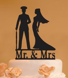 a wedding cake topper with a silhouette of a bride and groom