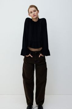 Loose-fit blouse in airy  woven viscose fabric. Ruffle collar  button and loop fastener at back of neck  and long raglan sleeves with a wide flounce at cuffs. Flared peplum. Uniform Accessories, Sportswear Trends, Kids Activewear, Loose Fit Blouse, Blouse Jeans, Cardigan Sweater Jacket, Peplum Blouse, Kids Outerwear, Ruffle Collar