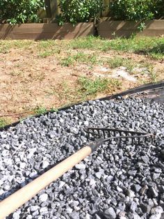 a metal grate sitting on top of a pile of rocks