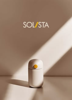 a white container sitting on top of a table next to a yellow and white logo