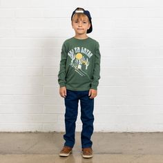 Hit the slopes in style with the Ski Ya Later Long Sleeve Tee! This cool and quirky 100% Cotton Jersey tee in forest green is perfect for those chilly days when adventure calls. Featuring a playful desert-inspired ski graphic, printed with non-toxic, water-based ink, this shirt is both safe and eco-friendly for your young explorer. Designed for durability and comfort, the tee is garment dyed and preshrunk, ensuring it stays true to size after every wash. And, of course, it’s machine washable for Ski Graphic, Toxic Water, Latest T Shirt, Big Adventure, Boys Long Sleeve, Swim Accessories, Jersey Tee, Jewelry Bags, Hat Hairstyles