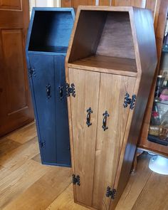 two wooden cabinets sitting on top of a hard wood floor