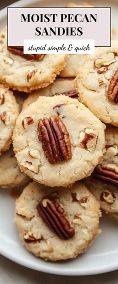 a white plate topped with cookies covered in pecans