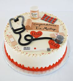 a cake decorated with medical supplies and writing