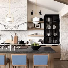 a kitchen with marble counter tops and blue chairs in front of the island, surrounded by open shelving