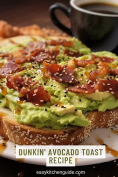 an avocado toast with bacon on it and coffee cup in the background text reads dunkin'avocado toast recipe